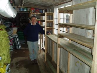 Dennis with his shelves Jan 2012